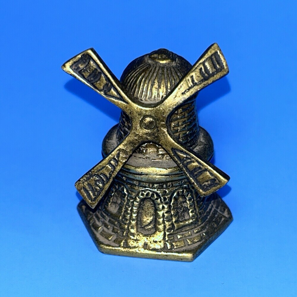 Brass spinning windmill shaped bell